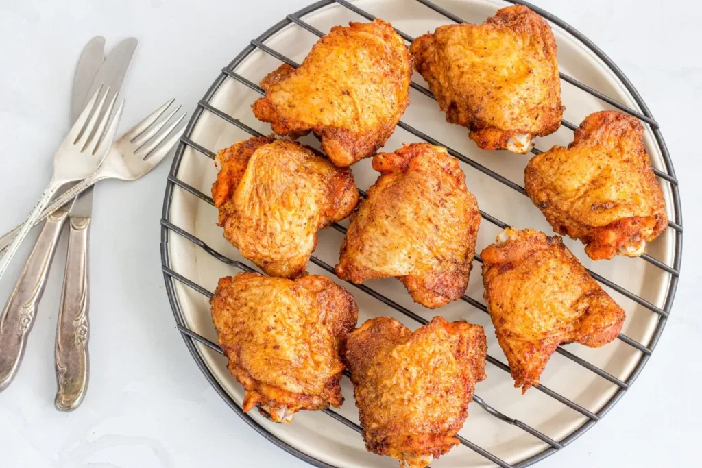 Crispy chicken thighs with caramelized edges baked at 400°F