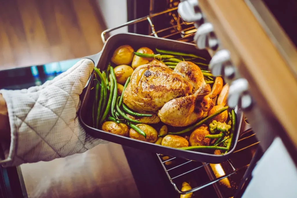 Chicken thighs and drumsticks baking in the oven at 350°F.